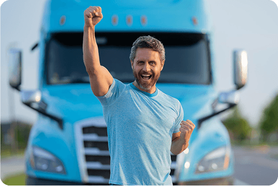 Truck driver standing confidently beside a truck