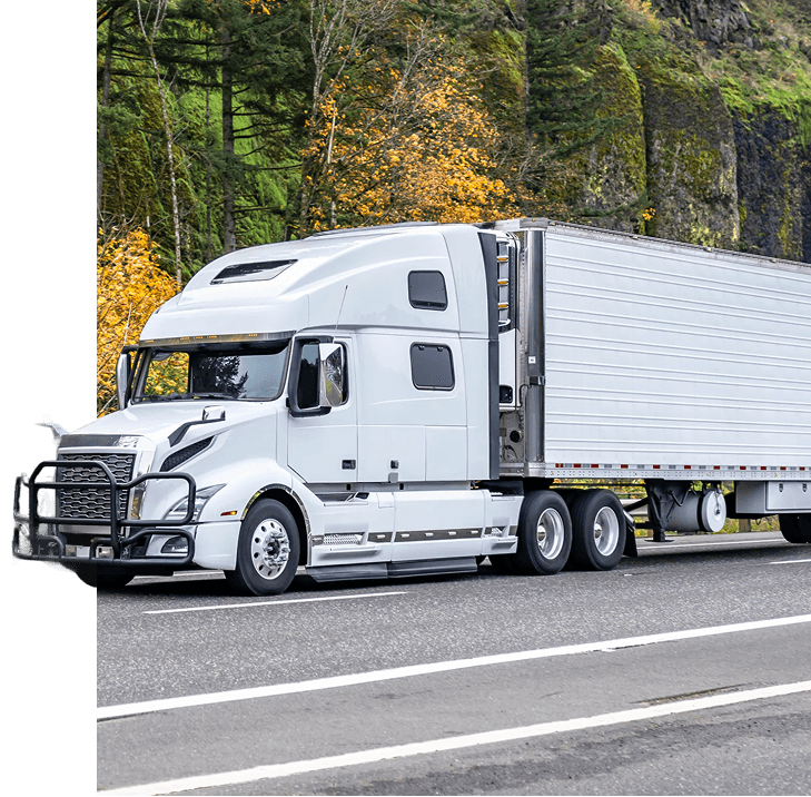 Semi trucks transporting shipping containers on a highway