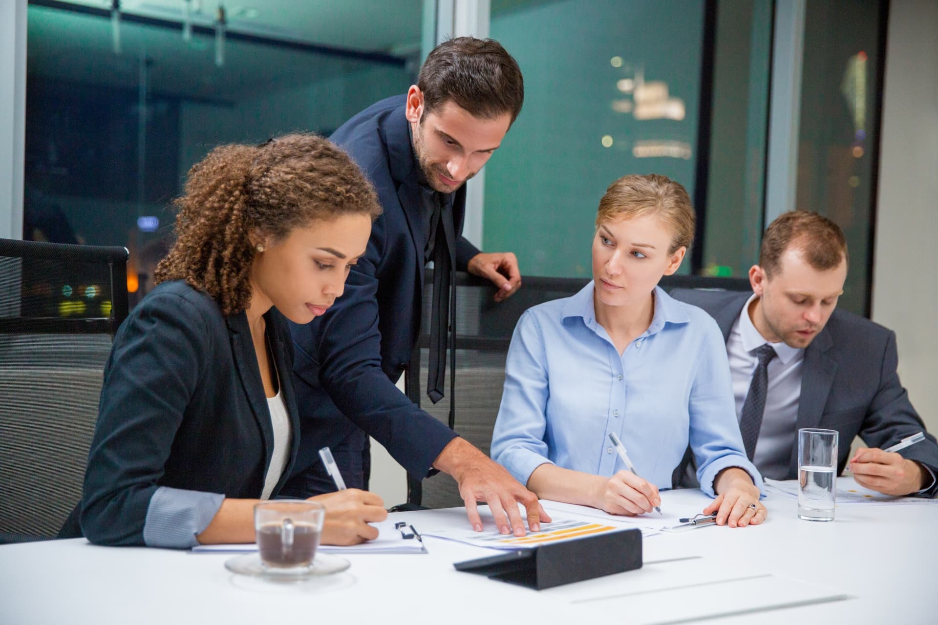Accounting team reviewing documents together in a meeting